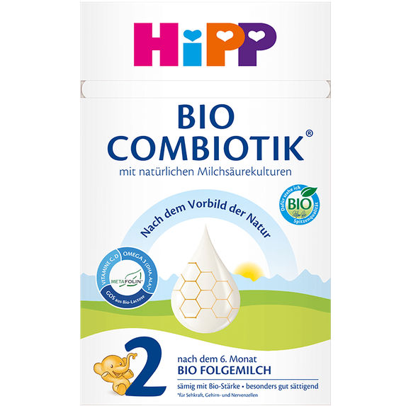 A package of Hipp Bio Combiotik Stage 2 organic formula, featuring a white box with colorful branding and illustrations of a bee and a green landscape.